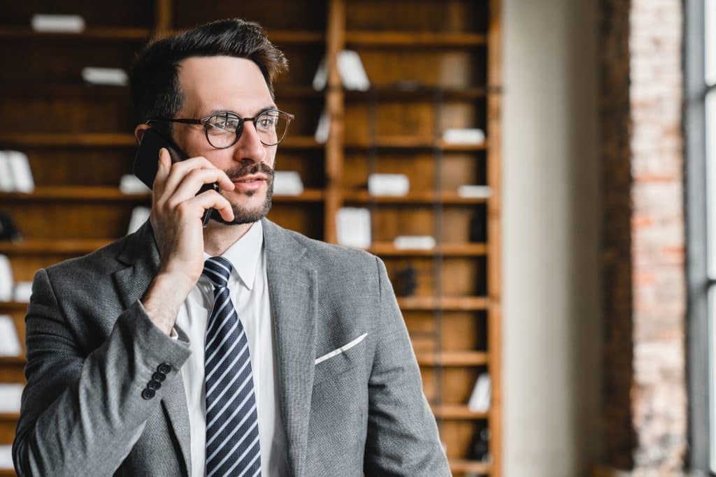 serious attorney on the phone in his office